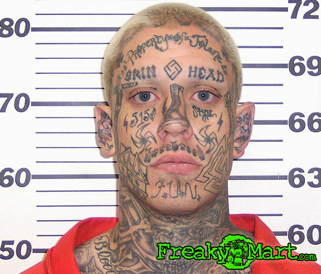This man with his tattooed face and neck and probably the rest of his body